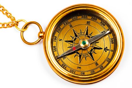 Old style brass compass on white backgroundの写真素材