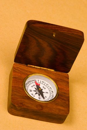 Old style wooden compass on old paper backgroundの写真素材