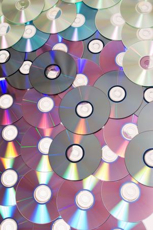 Pile of Many CDs or DVDs backgroundの写真素材