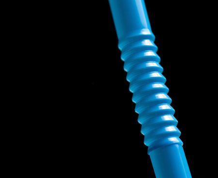 Blue straw isolated on black backgroundの写真素材