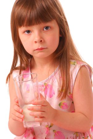 Girl with milk-moustache holding glass of milk, over white           の写真素材