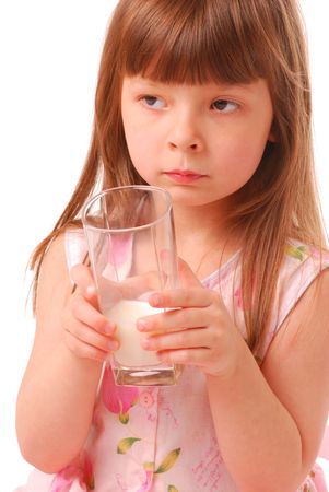 Girl with milk-moustache holding glass of milk, over white           の写真素材