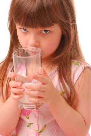 Girl with milk-moustache holding glass of milk, over white           の写真素材