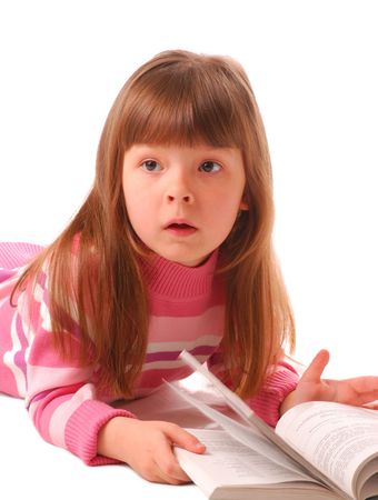 Little girl reading book over white backgroundの写真素材