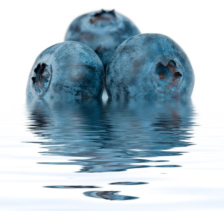 Blueberry close up isolated on white with reflection on waterの写真素材