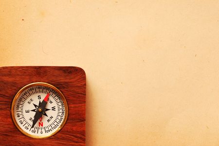 Antique wooden compass over old map backgroundの写真素材