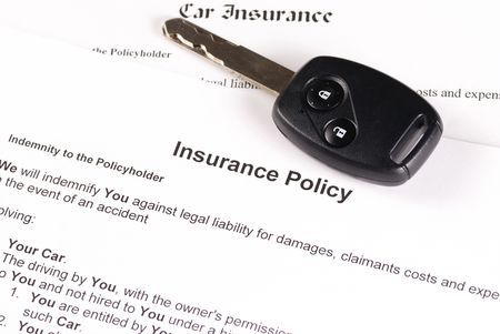 Car key on an insurance policyの写真素材