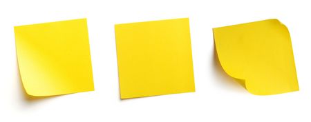 Yellow blank post-it notes isolated on whiteの写真素材