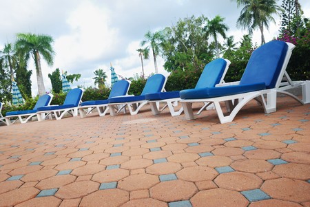 Chaise lounges near luxury hotel