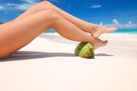Women's sexy legs on the beachの写真素材