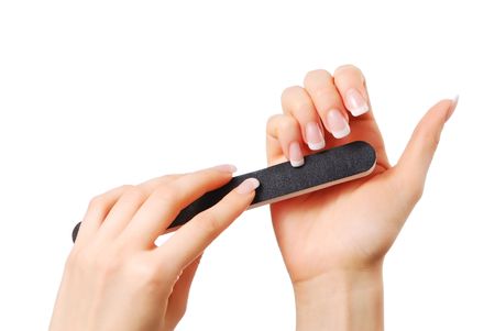 Woman polishing fingernails with the nail fileの写真素材