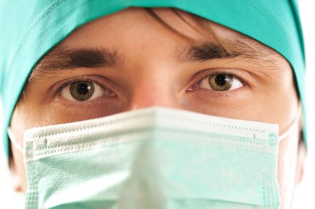 Doctor's face in mask close-upの写真素材