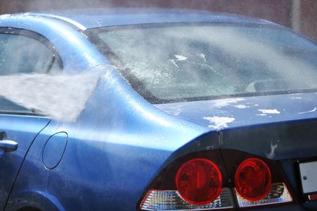 Blue car washing on open airの写真素材