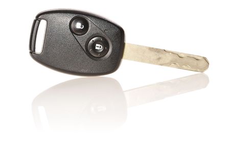 Car key isolated on white with soft reflectionの写真素材
