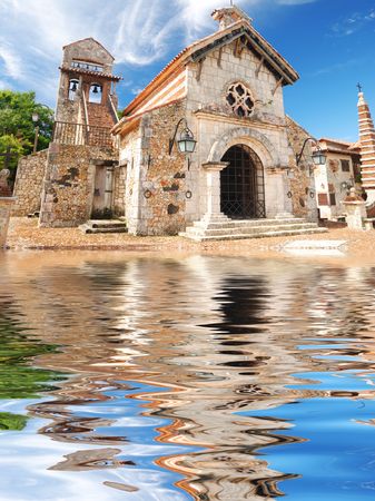 Old church in colonial town. Reflection in water.の写真素材