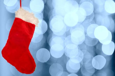 Christmas stocking against defocused background with shallow depth of field and copyspace