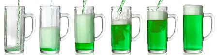 Green Beer mug isolated on white. Pouring green beer in it. 43 Mpxls.の写真素材