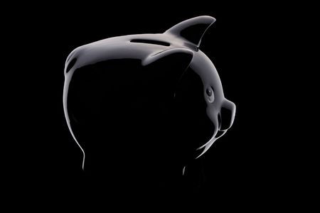Piggy bank silhouette over blackの写真素材