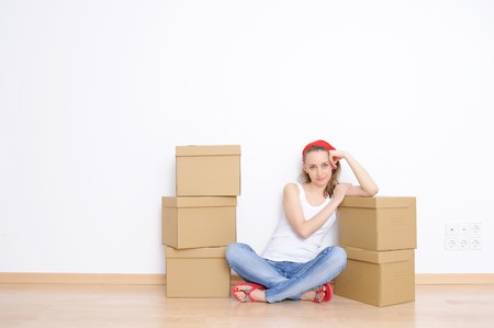 Woman resting from moving into a new home の写真素材
