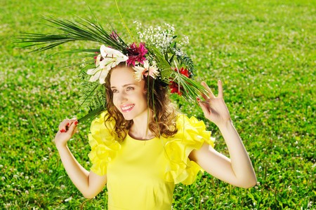 Girl with a wreath made from flowersの写真素材