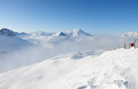 Mountains in clouds with snow in winter, Val-d'Isere, Alps, Franceの写真素材