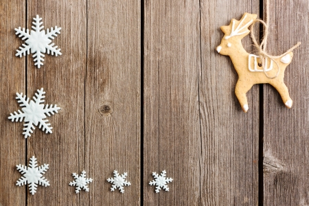 Christmas homemade gingerbread cookies over wooden tableの写真素材