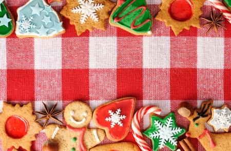 Christmas gingerbread cookies over tableclothの写真素材