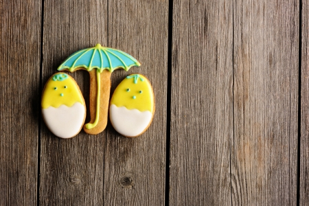 Easter homemade gingerbread cookie over wooden tableの写真素材