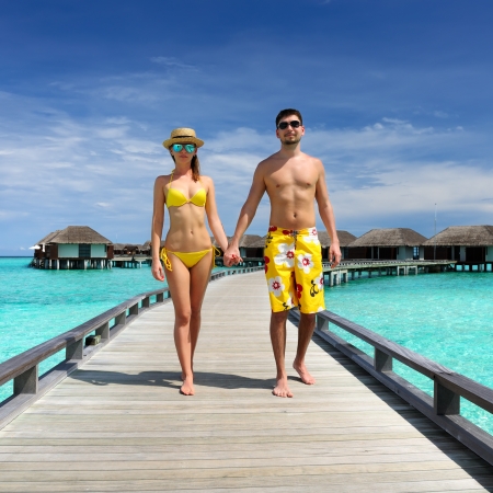 Couple on a tropical beach jetty at Maldivesのeditorial素材