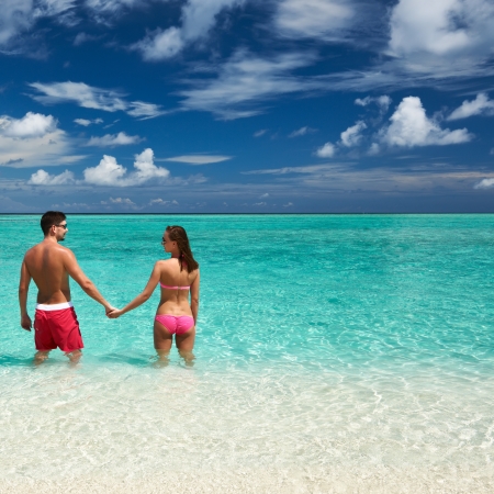 Couple on a tropical beach at Maldivesの写真素材