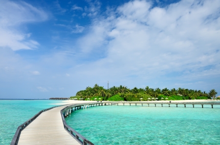 Beautiful beach with jetty at Maldivesの写真素材