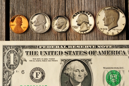 New uncirculated US money over wooden backgroundの写真素材