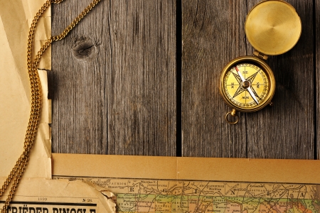 Antique brass compass over old mapの写真素材
