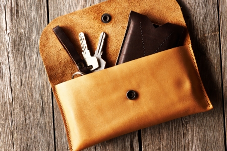 Handmade leather product over wooden backgroundの写真素材