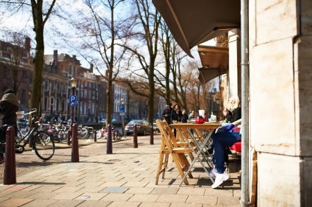 AMSTERDAM, NETHERLANDS - MARCH 31 2013: Amsterdam street cafe at spring, March 31, 2013のeditorial素材