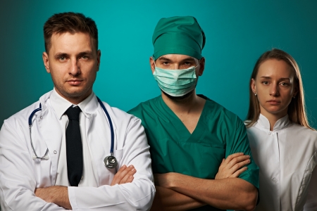 Medical team of doctors, two men and womanの写真素材