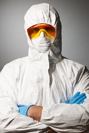 Scientist in protective wear, glasses and respirator の写真素材