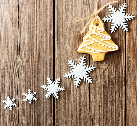Christmas homemade gingerbread cookies over wooden tableの写真素材