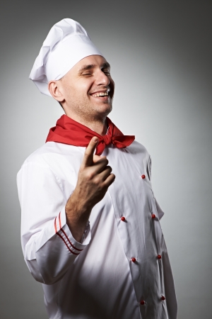 Male chef portrait against grey backgroundの写真素材