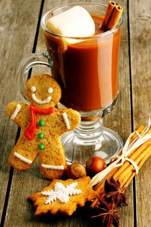 Glass of hot chocolate on wooden tableの写真素材
