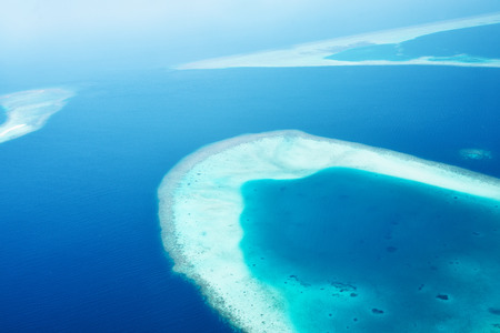 Group of atolls and islands in Maldives from aerial viewの写真素材