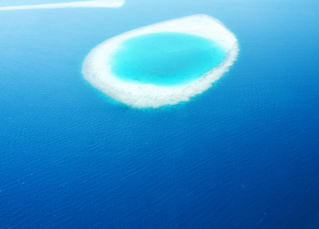 Group of atolls and islands in Maldives from aerial view