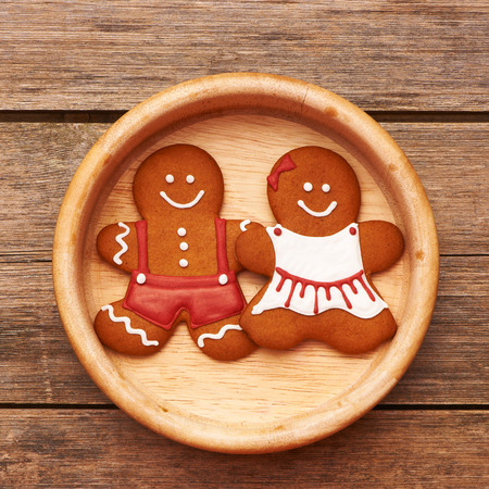 Christmas homemade gingerbread couple on tableの写真素材
