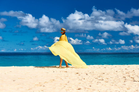 Woman with sarong at Seychelles beachの写真素材
