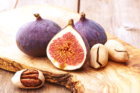 Fresh figs on rustic vintage wooden tableの写真素材