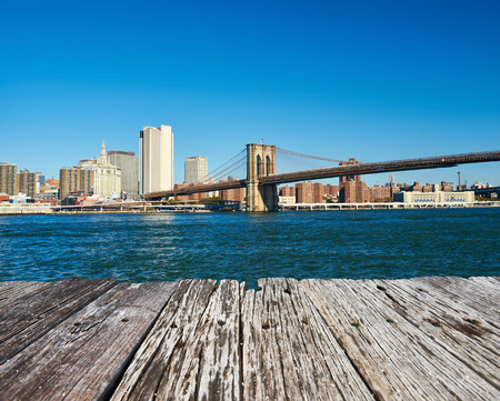 Lower Manhattan skyline and Brooklyn bridge in New York Cityの写真素材