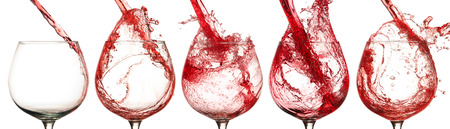 Pouring wine into a glassの写真素材