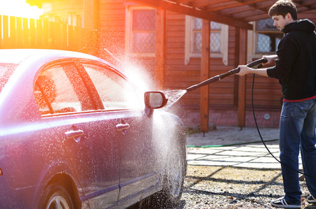 Blue car washing on open airの写真素材