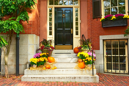 Pumpkins near the door during Halloween seasonの写真素材
