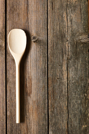 Wooden spoon on rustic backgroundの写真素材